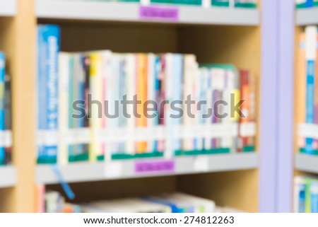 Blured books in public library. Blured effect. Background for you pictures