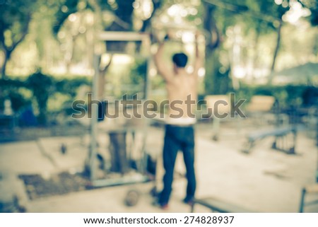 Exercise equipment in public park - Vintage and Blurred picture style 