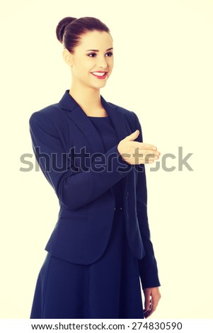 Young and beautiful businesswoman welcoming