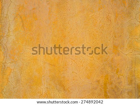 Close up of yellow brown cracked cement wall for with texture for background