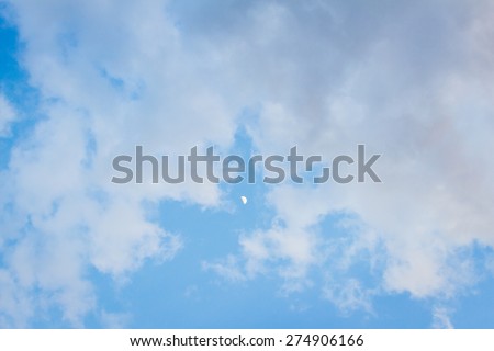 Blue and golden yellow clouds at with moon at sunset background