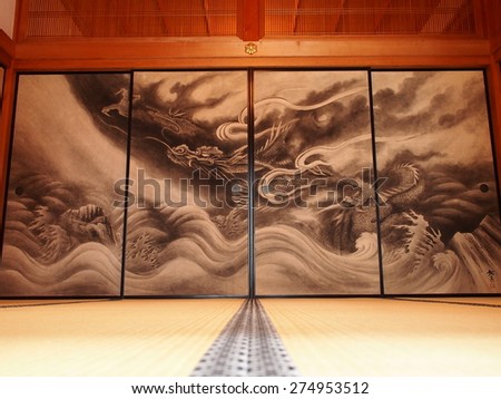 a papered sliding door used to partition off rooms in a Japanese house Royalty-Free Stock Photo #274953512