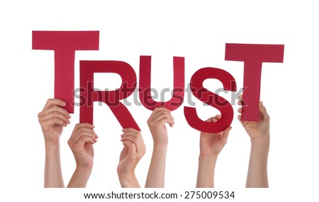 Many Caucasian People And Hands Holding Red Letters Or Characters Building The Isolated English Word Trust On White Background