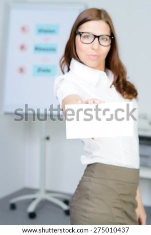 beautiful businesswoman shows a blank business card