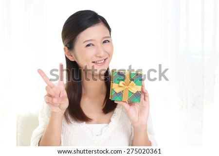 Smiling woman with a gift