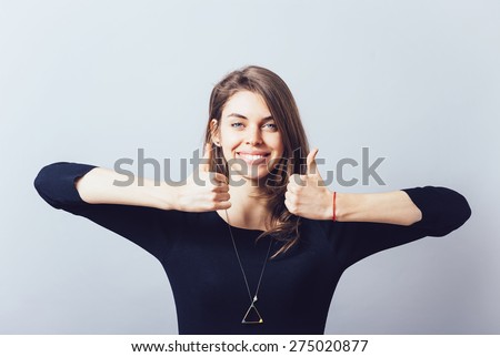 Girl shows big thumb up