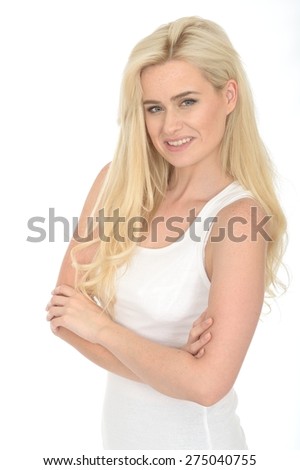 Happy Confident Young Woman  in Her Twenties Standing With Her Arms Folded