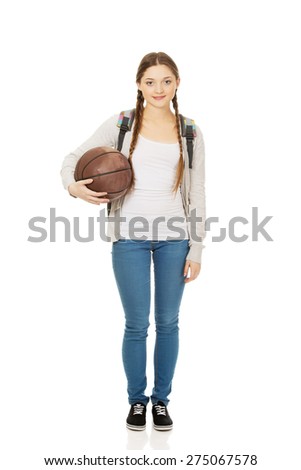Teenager with schoolbag and basket ball.