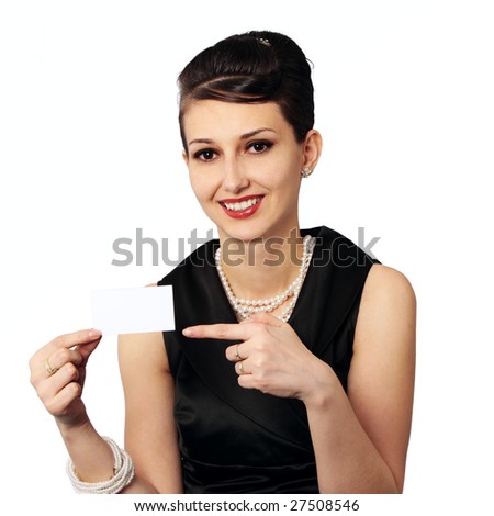 Smiling Audrey Hepburn alike as business woman with blank business card isolated on white background