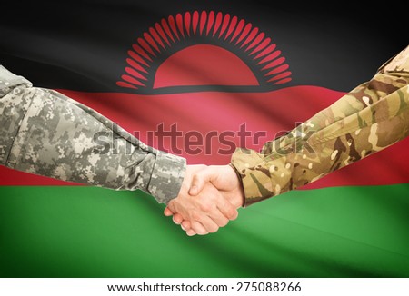 Soldiers shaking hands with flag on background - Malawi