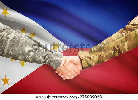 Soldiers shaking hands with flag on background - Philippines