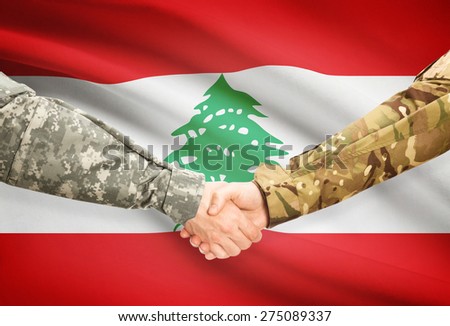 Soldiers shaking hands with flag on background - Lebanon