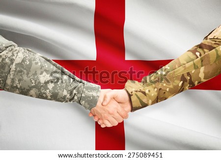 Soldiers shaking hands with flag on background - England
