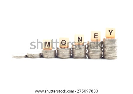 Image of  coins stacked and word MONEY over white background