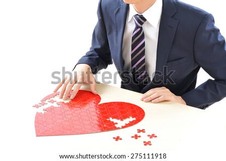 Businessman, which introduces a large red heart of jigsaw puzzle