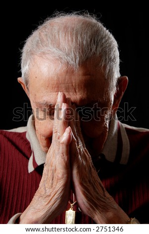 elderly's faith by praying with clasped hands