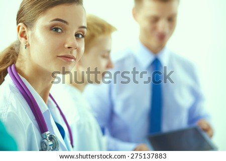 Woman doctor standing with stethoscope at hospital .