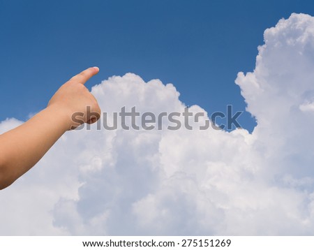 kid hand and clouds in the blue sky background