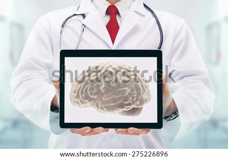Doctor with stethoscope in a hospital. Brain on the tablet . High resolution. 