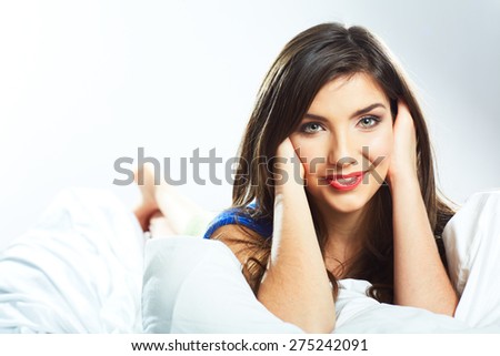 Young woman portrait resting in bed. Beautiful face girl.