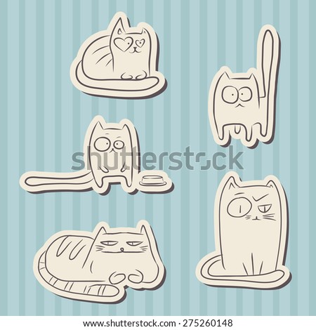 Paper cut hand drawn sketches of funny cats over blue vintage background.