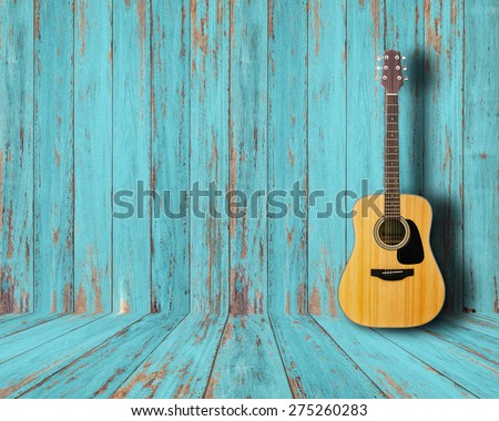 Guitar in vintage wood room. Royalty-Free Stock Photo #275260283