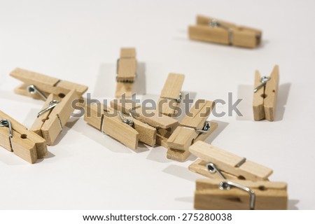 Wooden clothes pegs scattered on a table