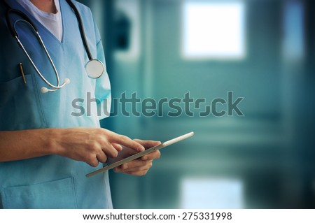 Healthcare And Medicine. Doctor using a digital tablet Royalty-Free Stock Photo #275331998
