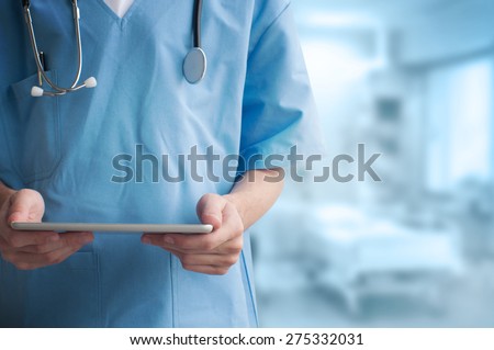 Healthcare And Medicine. Doctor using a digital tablet Royalty-Free Stock Photo #275332031