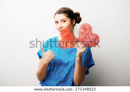 girl holding a paper heart