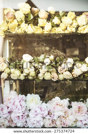 Assortment of colorful rose bouquets on the showcase