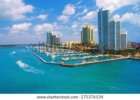 jet ski and boat sailing next to South Miami Beach