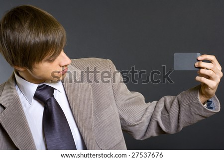 Business man showing a blank card