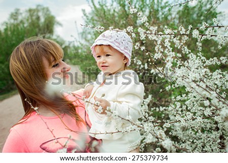 Happy Mum And Her Child Playing In Park Together