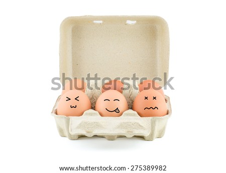 Funny Drawing Faces on Eggs in carton isolate on white with clipping path