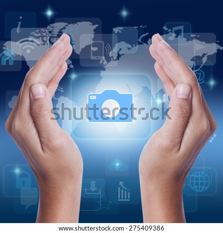 Hand showing camera icon symbol on screen. business concept