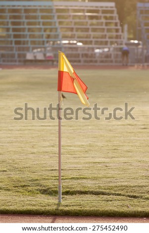 Corner flag on an soccer field at sunset
