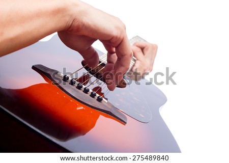 musician hands playing sunburst acoustic guitar, isolated on white