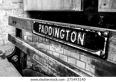 black and white image of an old bench at Paddington train station, London, UK