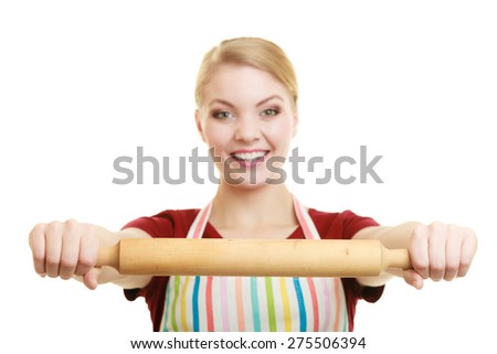 Happy housewife or baker chef wearing kitchen apron holds baking rolling pin studio picture isolated on white