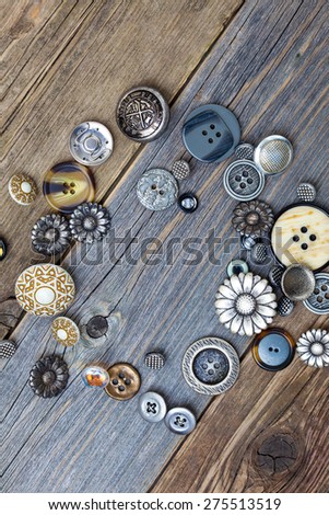 vintage buttons on old wooden boards
