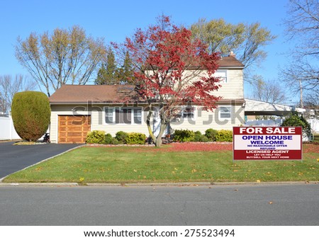 Real estate for sale open house welcome sign Suburban High Ranch style home Autumn Clear Blue Sky Day Residential Neighborhood USA
