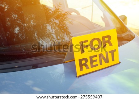 "RENT A CAR" sign on car - Rent a car concept
