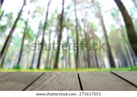 Defocus and blur image of terrace wood and Pine forest for background usage