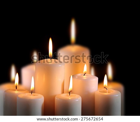 old candle on the black background 