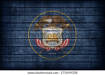 Utah flag pattern on wooden board texture ,retro vintage style