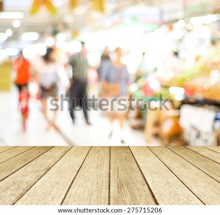 Perspective wood over blur market and people with bokeh background, product display