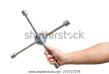Cross wrench in male hand isolated on white, with clipping path. maintenance concept