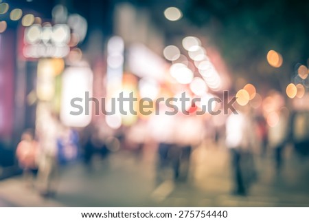 Abstract bokeh city night background with vintage color tone tuned 