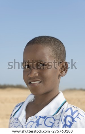 Afro boy at the beach, ten years old 